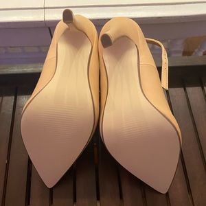 Tan heels with ankle wraps and locks. Brand New.